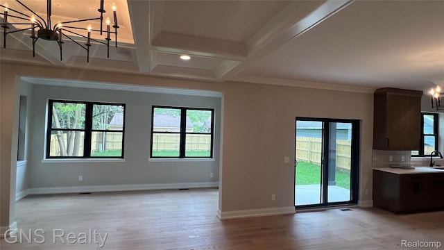 206 E Windemere Ave, Royal Oak, MI 48073 - kitchen with a chandelier, healthy amount of natural light, coffered ceiling, light wood finished floors, and beam ceiling
