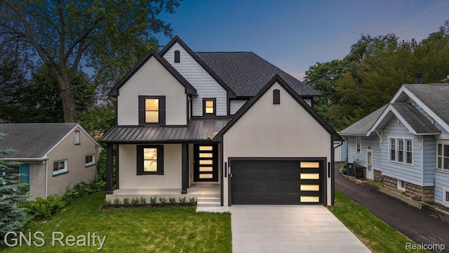 206 E Windemere Ave, Royal Oak, MI 48073 - view of front of home with covered porch, concrete driveway, an attached garage, stucco siding, and a yard