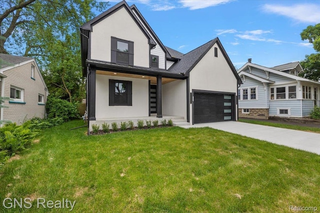 206 E Windemere Ave, Royal Oak, MI 48073 - view of front of property with a front lawn, concrete driveway, a garage, stucco siding, and covered porch