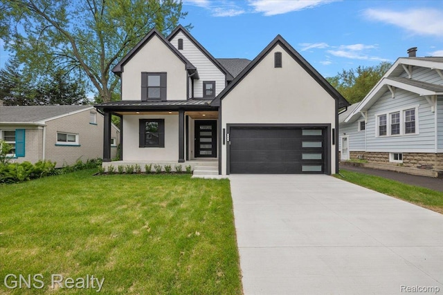 206 E Windemere Ave, Royal Oak, MI 48073 - view of front of property featuring stucco siding, a front yard, a standing seam roof, a garage, and driveway