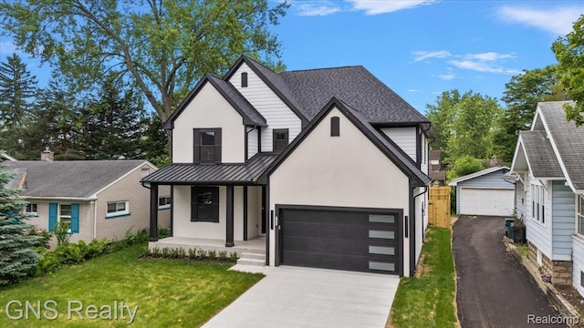 206 E Windemere Ave, Royal Oak, MI 48073 - view of front of property featuring stucco siding, a standing seam roof, a front yard, concrete driveway, and covered porch