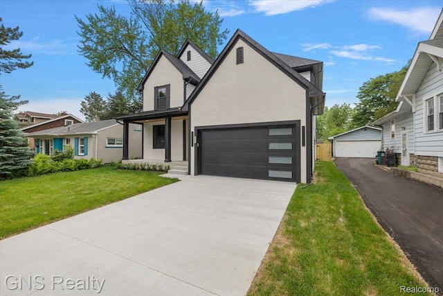 206 E Windemere Ave, Royal Oak, MI 48073 - view of front of property featuring stucco siding, a front lawn, driveway, and an attached garage