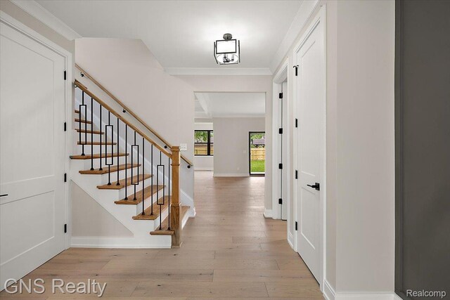 206 E Windemere Ave, Royal Oak, MI 48073 - foyer with wood finished floors, stairs, and crown molding