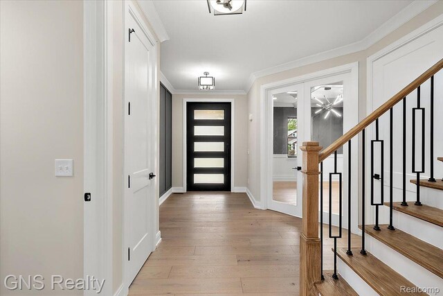 206 E Windemere Ave, Royal Oak, MI 48073 - foyer entrance featuring stairway, light wood-style flooring, and ornamental molding