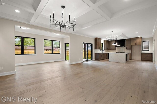 206 E Windemere Ave, Royal Oak, MI 48073 - unfurnished living room featuring a chandelier, coffered ceiling, recessed lighting, beamed ceiling, and light wood-style floors