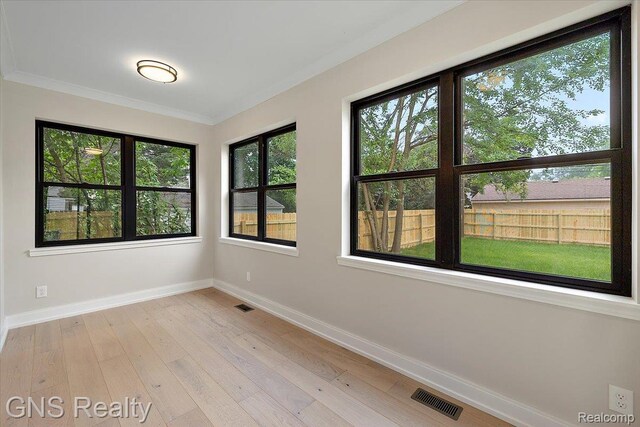 206 E Windemere Ave, Royal Oak, MI 48073 - spare room with light wood-style floors and crown molding