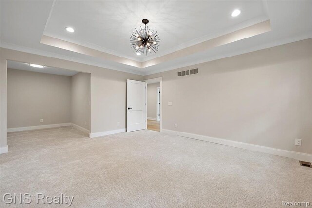 206 E Windemere Ave, Royal Oak, MI 48073 - empty room featuring a raised ceiling, crown molding, light carpet, recessed lighting, and a chandelier