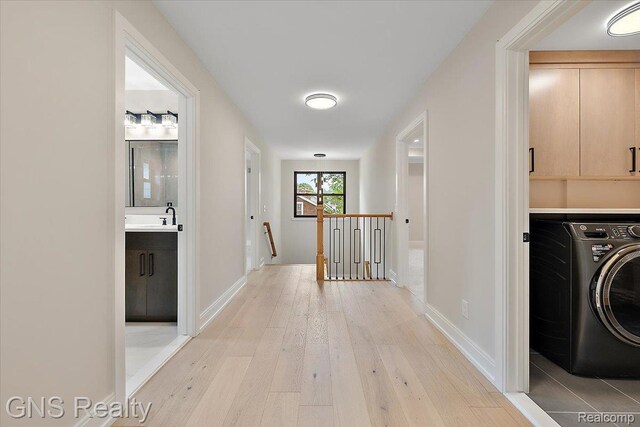 206 E Windemere Ave, Royal Oak, MI 48073 - hallway with washer / clothes dryer, an upstairs landing, and light wood-type flooring