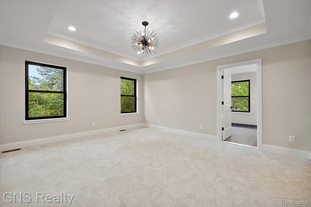 206 E Windemere Ave, Royal Oak, MI 48073 - spare room with a raised ceiling, a chandelier, recessed lighting, crown molding, and carpet flooring