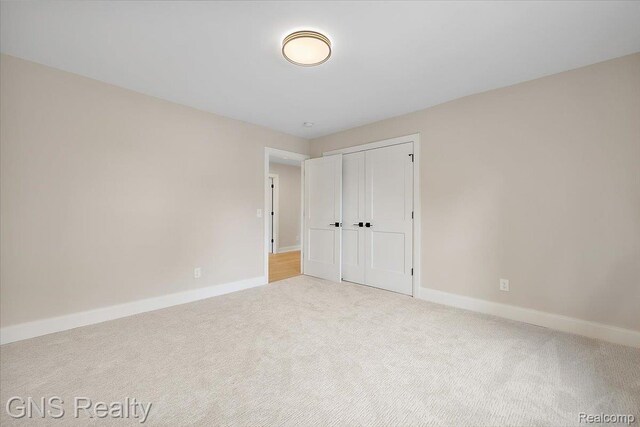 206 E Windemere Ave, Royal Oak, MI 48073 - unfurnished bedroom featuring carpet flooring and a closet