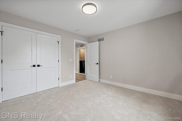 206 E Windemere Ave, Royal Oak, MI 48073 - unfurnished bedroom with carpet flooring, baseboards, and a closet