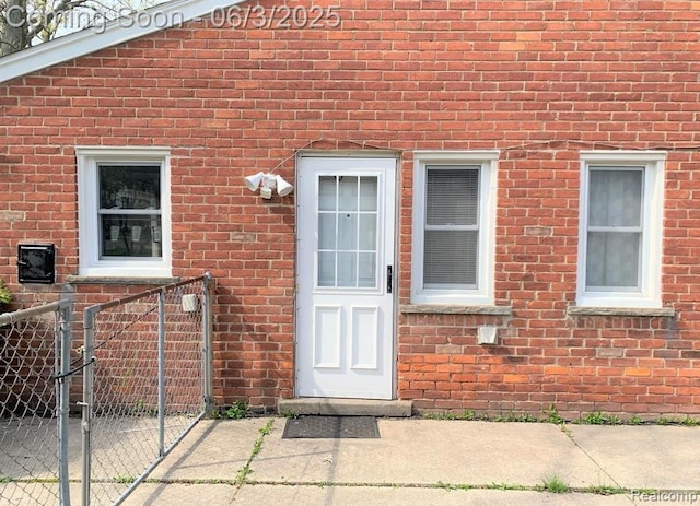 28132 Brentwood St, Southfield, MI 48076 - doorway to property with brick siding and a gate