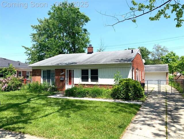 28132 Brentwood St, Southfield, MI 48076 - single story home with brick siding, a chimney, a garage, and board and batten siding