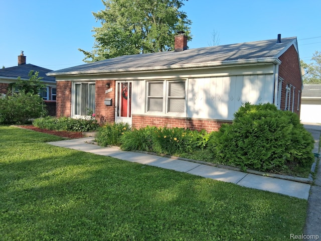 28132 Brentwood St, Southfield, MI 48076 - ranch-style house featuring brick siding, a front yard, a chimney, and roof with shingles