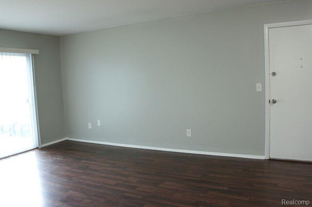 966 Bloomfield Village Blvd, Auburn Hills, MI 48326 - spare room with dark wood finished floors and baseboards