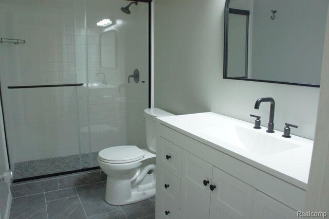 966 Bloomfield Village Blvd, Auburn Hills, MI 48326 - full bathroom featuring toilet, a stall shower, vanity, and tile patterned flooring