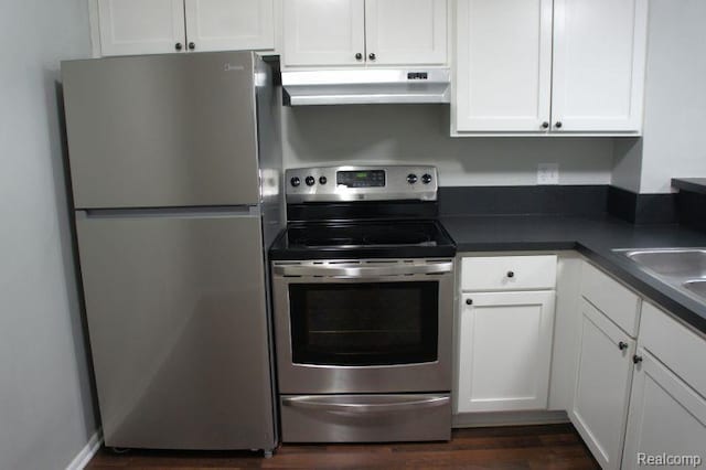 966 Bloomfield Village Blvd, Auburn Hills, MI 48326 - kitchen featuring appliances with stainless steel finishes, under cabinet range hood, white cabinetry, and dark countertops