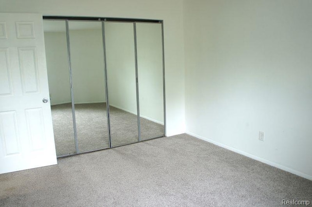 966 Bloomfield Village Blvd, Auburn Hills, MI 48326 - unfurnished bedroom featuring carpet, a closet, and baseboards