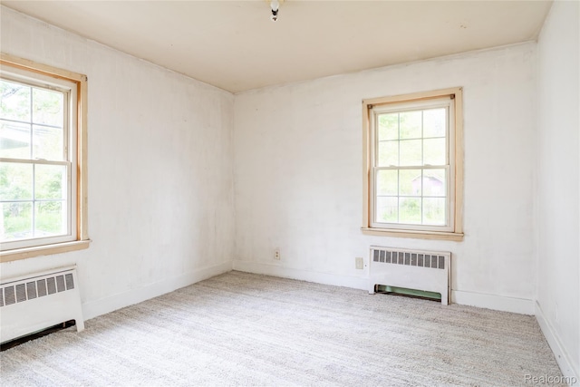 2028 9th St, Port Huron, MI 48060 - carpeted spare room with radiator and baseboards