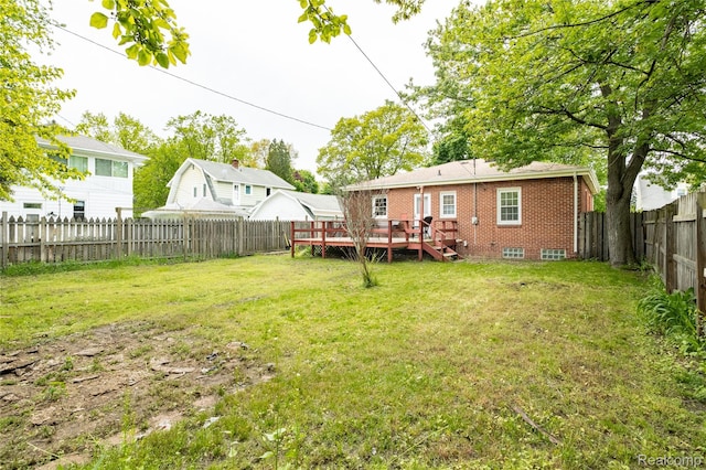 2028 9th St, Port Huron, MI 48060 - back of property with a deck and brick siding