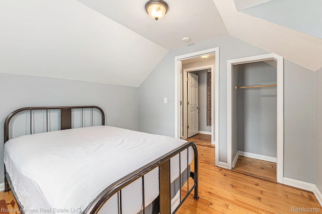 30 Charlevoix St, Clawson, MI 48017 - bedroom with light wood finished floors, lofted ceiling, baseboards, and a closet