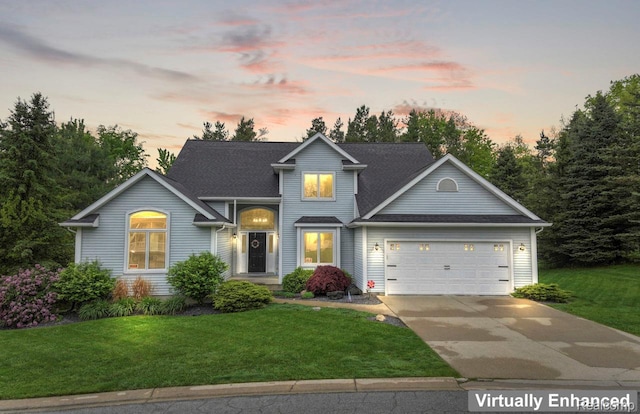 3648 Wedgewood Dr, Lapeer, MI 48446 - traditional-style house featuring driveway, a garage, a front lawn, and a shingled roof