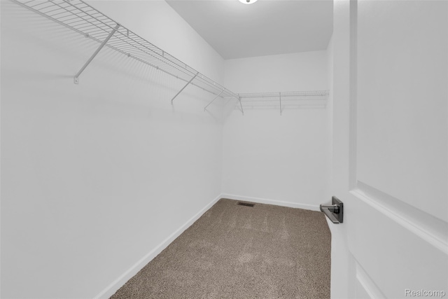 10705 Deer Ridge Trl, Rose, MI 48442 - spacious closet featuring carpet