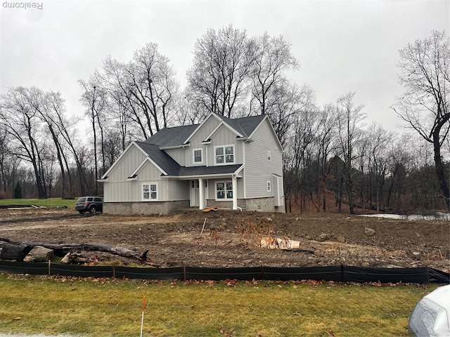 10705 Deer Ridge Trl, Rose, MI 48442 - view of front facade featuring board and batten siding