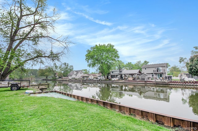 35274 Lake Dr, Brownstown, MI 48173 - dock area featuring a water view, a residential view, and a yard