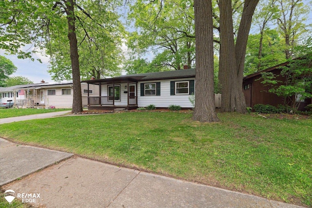3825 Craig Dr, Flint, MI 48506 - ranch-style house with covered porch, a front lawn, and a chimney
