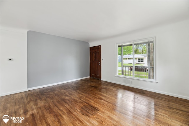 3825 Craig Dr, Flint, MI 48506 - empty room featuring wood finished floors and baseboards