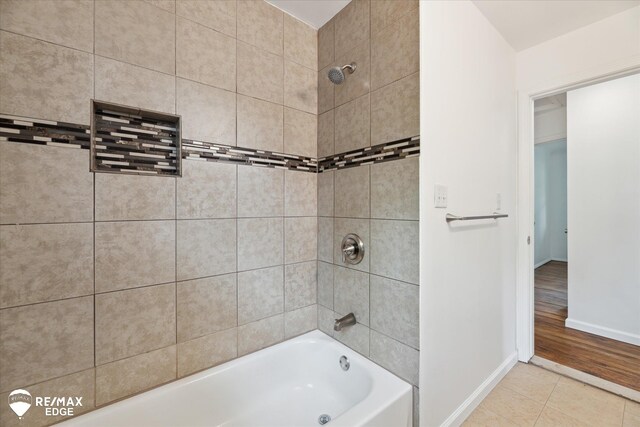 3825 Craig Dr, Flint, MI 48506 - bathroom with baseboards, tile patterned flooring, and shower / bathtub combination