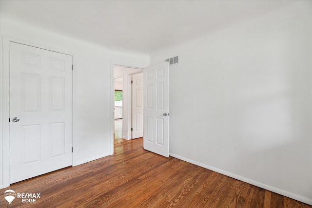 3825 Craig Dr, Flint, MI 48506 - unfurnished bedroom with baseboards and wood finished floors