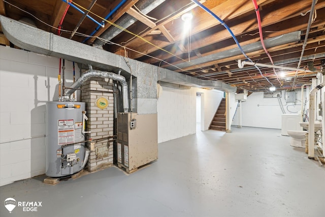 3825 Craig Dr, Flint, MI 48506 - unfinished below grade area featuring water heater, stairs, washer / dryer, heating unit, and concrete block wall
