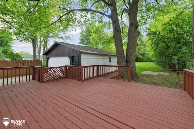 3825 Craig Dr, Flint, MI 48506 - wooden terrace with a detached garage and an outdoor structure