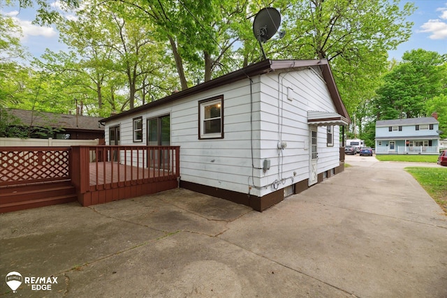 3825 Craig Dr, Flint, MI 48506 - rear view of property featuring a wooden deck and a patio area