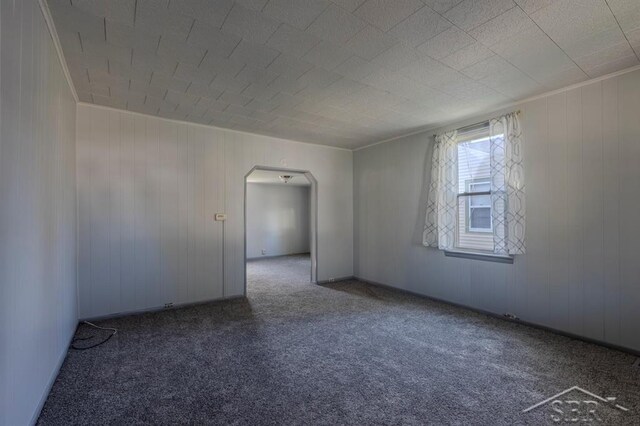 1303 S Warner St, Bay City, MI 48706 - carpeted empty room featuring arched walkways