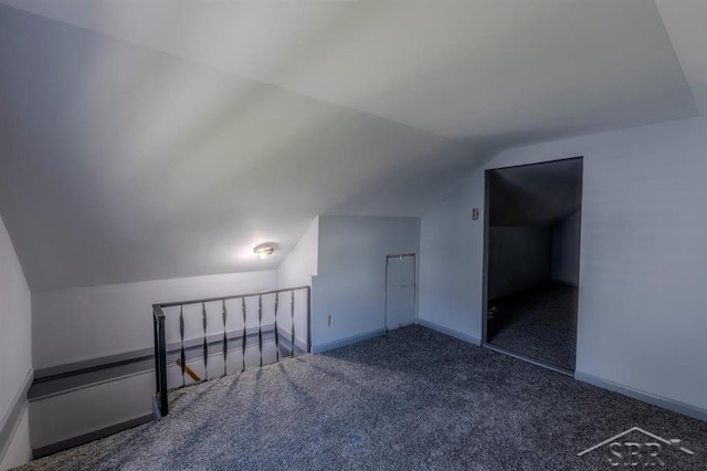 1303 S Warner St, Bay City, MI 48706 - bonus room featuring vaulted ceiling, carpet flooring, and baseboards