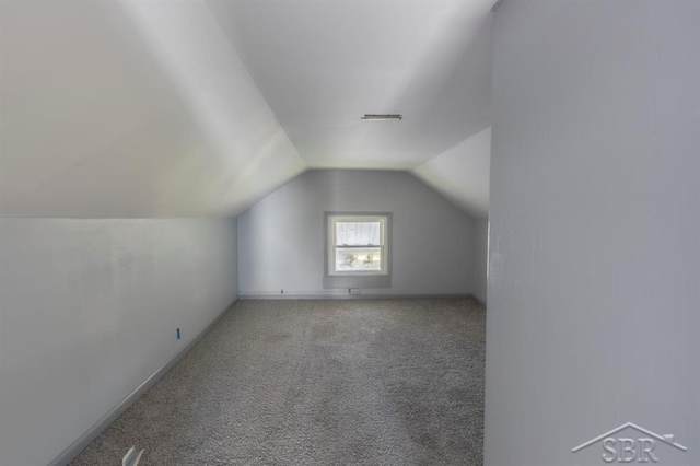 1303 S Warner St, Bay City, MI 48706 - bonus room featuring carpet flooring, vaulted ceiling, and baseboards