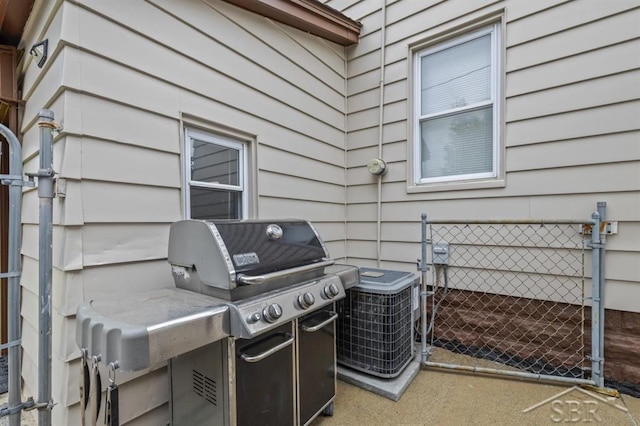 705 W Jenny St, Bay City, MI 48706 - view of patio / terrace with a gate, central AC, and area for grilling