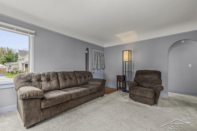 705 W Jenny St, Bay City, MI 48706 - carpeted living area with arched walkways and baseboards