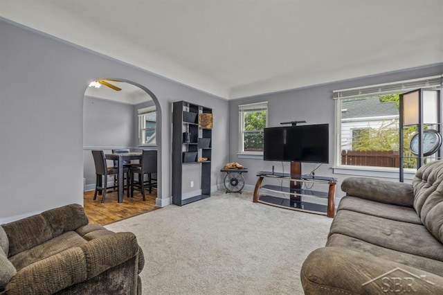 705 W Jenny St, Bay City, MI 48706 - carpeted living room featuring arched walkways and baseboards
