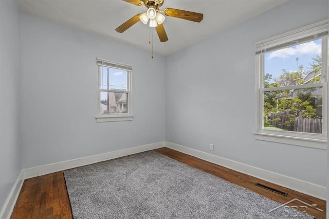 705 W Jenny St, Bay City, MI 48706 - empty room with baseboards, wood finished floors, and ceiling fan