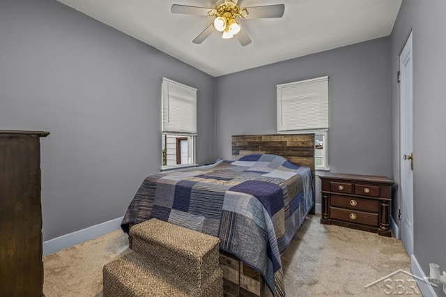 705 W Jenny St, Bay City, MI 48706 - bedroom with carpet flooring, baseboards, and a ceiling fan