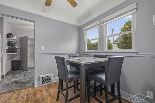705 W Jenny St, Bay City, MI 48706 - dining space with wood finished floors, baseboards, and ceiling fan