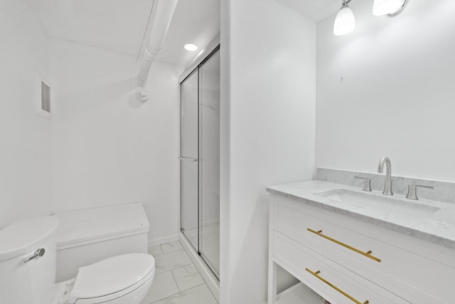 34 Mathison Rd, Traverse City, MI 49686 - bathroom featuring toilet, marble finish floors, a shower stall, vanity, and baseboards