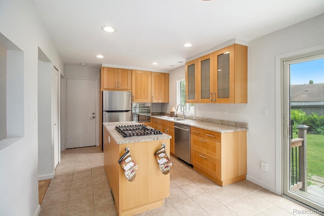 7831 Caberfae Trl, Clarkston, MI 48348 - kitchen featuring stainless steel appliances, a sink, plenty of natural light, recessed lighting, and glass insert cabinets