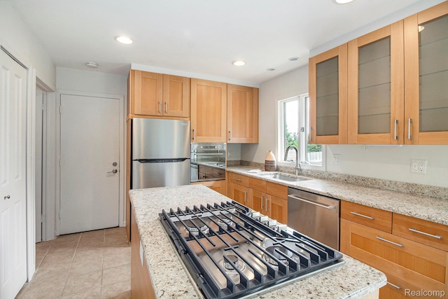 7831 Caberfae Trl, Clarkston, MI 48348 - kitchen featuring stainless steel appliances, a sink, recessed lighting, light stone counters, and light tile patterned flooring