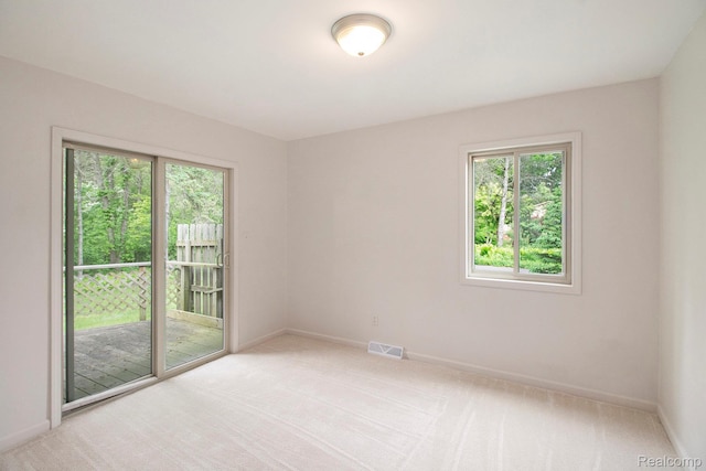 7831 Caberfae Trl, Clarkston, MI 48348 - empty room featuring plenty of natural light, light carpet, and baseboards