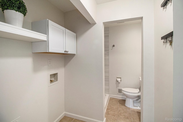 7831 Caberfae Trl, Clarkston, MI 48348 - washroom with washer hookup, baseboards, and light tile patterned flooring